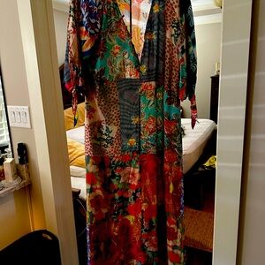 Johnny was dress buttons down to the waist has three-quarter length sleeves